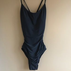 Black one piece swimsuit with crisscross backing.